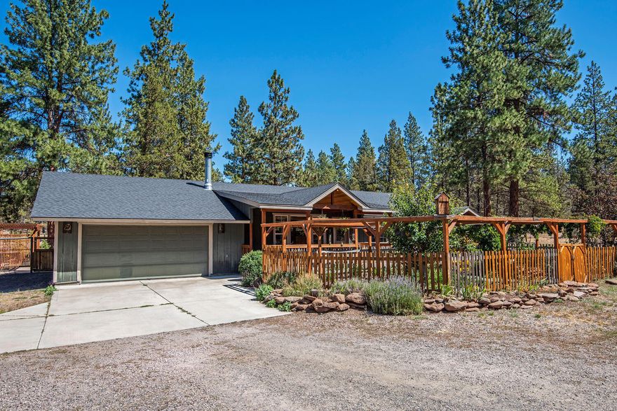 Desirable single-level home on 5 acres with no HOA. Multiple outbuildings on property: Cottage/studio with full bathroom/walk-in closet; Small Barn/studio; Shop with cement floor/multiple workspaces; Garden shed; Log play structures. Interior features of home: New wood stove insert; Wood wrapped windows and door trim; Granite/extra height countertops in kitchen; Walk-in pantry; Mudroom with access to garage & laundry; Huge laundry room; Oversized finished attached garage; Generous dining room with pass through to kitchen; Large guest room with walk-in closet; Tile flooring in bathrooms/new toilets; Large master bedroom with access to outside sitting area; Soaking tub with jets/double sink in master bath; Large walk-in closet. Exterior features of property: Large covered front deck overlooking flower/vegetable garden; Large back deck and patio with gazebo; High fenced back yard/park like area; Private well; Brand new septic system.