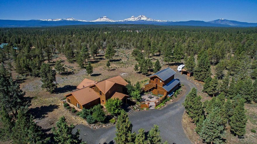 Timber Frame Home of the Year in 2009! Secluded 27 ac in Cloverdale with Mountain views. Open floor plan with vaulted ceilings, main flr master, walk-in shower, gourmet kitchen, office; upstairs master suite w/loft. Reclaimed fir cabinets & living rm floor, stainless appliances & island counter, granite counters, travertine tile. Highest rating energy efficiency w/SIP ceilings & walls, solar electric & hot H2O,in-floor heating. Detached ICF garage/workshop w/upstairs apartment. Stone-coated steel roof.