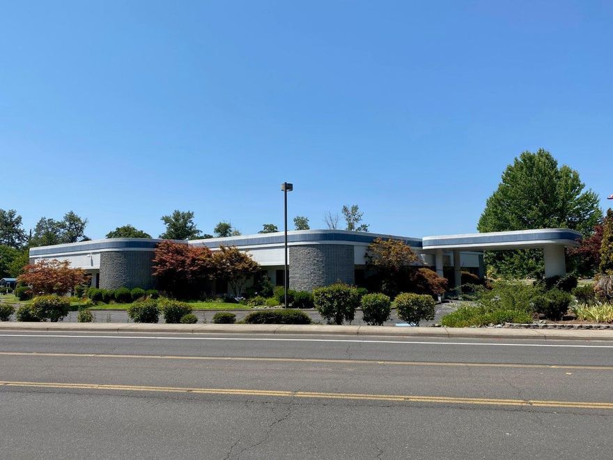 Well built, approx. 17,760 SF office building situated  on a very large, campus-style lot with an abundance of parking and amenities.  The property is approx. 6.39 total acres, 4.09 acres of which are improved with 212 parking spaces, a sports court, a covered pavilion building and a back-up 450 KW Cummins generator.  The main building is built out as first-class office space with an open floor plan, including 11 private offices and 2 conference rooms.  Other building amenities include a large server room, is adjacent to the Asante Three Rivers Medical Center campus.  Situated on the corner of Nebraska Avenue and Ramsey Avenue, in close proximity to high-traffic Redwood Highway.
