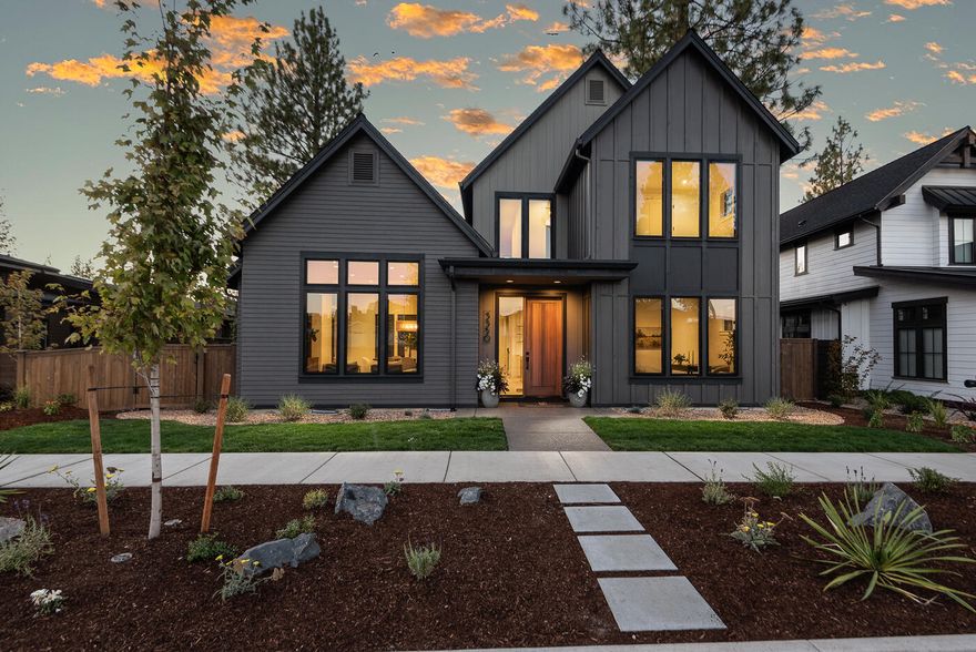 Experience refined living in this beautifully crafted American Farmhouse by Structure Development NW, perfectly positioned in Bend's sought-after Discovery West neighborhood. Blending classic charm with modern sophistication, this home features an open-concept layout centered around a warm, inviting great room with a cozy fireplace. The chef's kitchen is a showstopper, with a sprawling island, premium appliances, walk-in pantry, and adjacent dining area—ideal for everyday living and entertaining. The main-level primary suite offers a peaceful retreat with a tiled shower and generous walk-in closet. A dedicated office, powder room, mudroom, and laundry add daily convenience. Upstairs, discover two guest bedrooms, a full bath, and a versatile bonus room that easily doubles as a fourth bedroom. Enjoy outdoor living on the covered patio in the landscaped, fenced yard. A spacious 3-car garage includes a tall third bay with a 10' door—perfect for your Sprinter van or adventure gear.