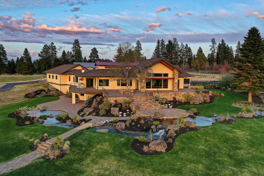 Stunning Estate Residence with panoramic mounting views on 40 lush acres in one of the best locations in Bend. Grand entry to spacious great room with open beams, gourmet kitchen with top quality appliances, huge island, wine/beer bar & butler pantry. Master suite with fireplace, coffee bar & custom tiled bathroom, plus 2 additional bedroom suites, elevator & private office. Extensive use of wood & tile flooring. Incredible outdoor living space with expansive paver decks overlooking the huge pond/water features, glass railings, gas fire pit, hot tub & BBQ. Additional unfinished lower level waiting for your finishing touches with wine room (3,100 more sq ft). Fully irrigated hay fields, 3 deluxe ponds, white fencing, tree nursery, professional landscaping & secure entry gate. Huge shop/RV building with geothermal heating system, epoxy floors & bath (4,000 sq ft plus 1,400 sq ft mezzanine).
