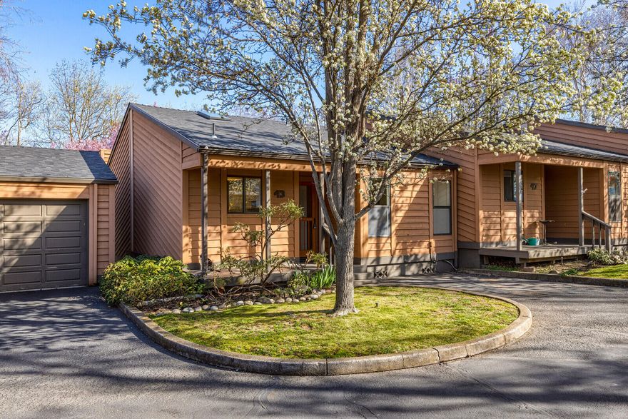 Lovely townhouse in highly desired community. The HOA fees covers landscaping, community pool, garbage & water. Stepping into this home, one is immediately greeted with a bright living space & large picture windows overlooking the beautifully landscaped community open space. The bamboo floors tie the living space together & leads to the back deck that is perfect for indoor/outdoor living. A bedroom and spacious bathroom also sit on the main floor. Downstairs is a full primary suite with a large walk-in closet and ample storage in the basement. There is fresh interior paint & new carpeting. The well-cared-for development sits along Ashland Creek & just next door to Ashland Creek Park. This home is just blocks to the Ashland Food Co-op & the Ashland Plaza. Truly a lovely home in a dream location.