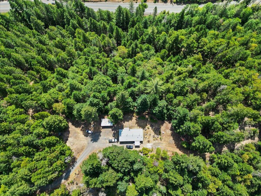 Discover Serenity at 197 Gold Canyon Road, Selma, Oregon 97538

Nestled in the heart of Josephine County's breathtaking landscape, this recently upgraded, 3-bedroom, 2-bathroom manufactured home offers comfort and seclusion. Lovingly cared for over 30 years by the current owners, this heavily treed, creek-front property sits atop a knoll on 21+ acres. Enjoy the crisp and clean water from the spring-fed cistern and fruit from the many trees adjacent to the home. 
Just minutes from world-class hiking, fishing, and the untamed wonders of the Kalmiopsis Wilderness, this property is a gateway to outdoor enjoyment, assuming you actually want to leave.