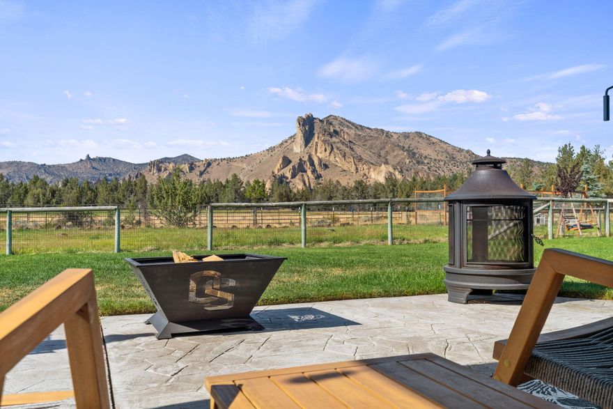 Breathtaking Smith Rock views and sunsets from this custom built newly remodeled 4090 square-foot fully fenced 4.29 acre gated estate. Attached triple car garage with separate 28 x 28 separate two car garage for a total of 5 car garages. 2.74 irrigated acres, greenhouse, garden (ready to harvest), chicken/duck coops, RV hook ups (minus dump), above ground pool and could be horse property or farm cows. Large Covered front porch overlooking water feature, with great room floor plan, oversized rock fireplace, soaring ceilings with tongue and groove details, office/library, newly remodeled, gourmet kitchen with adjacent dining and family room. Primary bedroom overlooking sunsets with dual closets and sinks, soaking tub overlooking Smith rock and tiled. Shower with separate back door access. Two separate laundry room hook ups on each level. Separate stairwell to bonus room on second level three bedrooms upstairs with a potential fourth. County shows separate 448 square-foot unfinished atti
