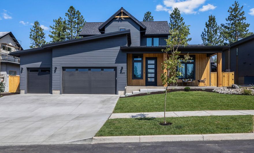 Welcome to this new contemporary NW style home in the highly sought-after neighborhood of Shevlin West. This exquisite home, built by Bruce Wiechert Custom Homes, Inc, offers a blend of luxury, comfort, and contemporary design. The stunning open floor plan features beautiful wood beams, wood flooring, and vaulted ceilings that create a welcoming atmosphere. The heart of the home is the gourmet kitchen with rift oak cabinetry, an expansive island with a waterfall quartz countertop, and top-of-the-line SS appliances. Natural light floods the interior through expansive windows, highlighting the immaculate craftsmanship and attention to detail. This luxurious home includes a 3-car garage, 4-spacious bedrooms, and a bonus room, some rooms offering panoramic Cascade Mountain views. Outside, enjoy multiple entertainment areas, full landscaping, a fenced-in level lot, and the upcoming Manzanita Ridge Park just steps away. Come and find your perfect home in Shevlin West.