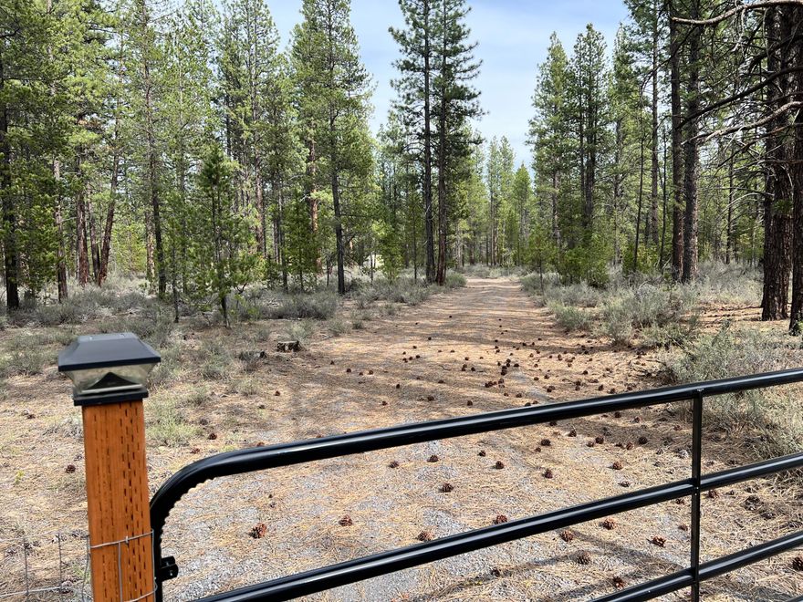 Large, almost 14 acre, nicely forested homesite is ready for your project! Large level homesite and septic already approved by county, with new well installed! Midstate Electrical co-op has power at the street and has great pricing on service, too. Gravel driveway and small gate lead you the build site in the middle of some large Ponderosa pines. The work was already done to turn the property into a home, so you can begin your project quickly or simply enjoy the property until it's time for your project.
A temp building, with solar, is available, too, if that's desired. It's private property and can be purchased outside of Escrow.
La Pine is minutes away and is growing quickly providing Medical, Dining, shopping and recreational opportunities for you to enjoy and participate in.
Very quiet area! Dark skies, for solar viewing and unlimited fishing and hunting opportunities abound nearby. Elk, deer, red-tail hawks, and more are numerous in the community. Don't miss this opportunity