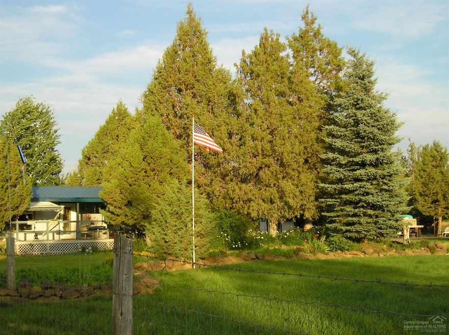 Hobby farm, close in! 8.05 acres w/5 acres COI. Manufactured home has open floor plan, master separation, cozy wood stove, Vinyl windows, metal roof. There is also a green house, garden shed plus a 24'x48' shop with concrete floor, large doors at either end. Barn has heated tack room, stall and storage. Shop & barn has their own power source separate from the home. Don't forget the pond, garden area, round pen & your own Raspberry patch. This property has lots to offer.