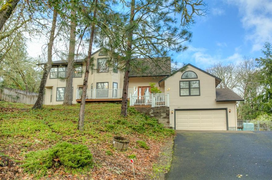 Custom built 4 bedroom and 3 bath home with 2896 sq. ft. on the most beautiful park-like 1.1 acre lot. Tile entry way. Vaulted ceiling and electric fireplace in the living room, formal dining room, pellet stove in the family room that adjoins the kitchen and there are 2 heat pumps, one for each level. There is a deck off the front entry and patio off the kitchen that is perfect for entertaining. City services and amazing privacy. Seller will provide Buyer with a Fidelity National Comprehensive Plus Home Warranty Plan.