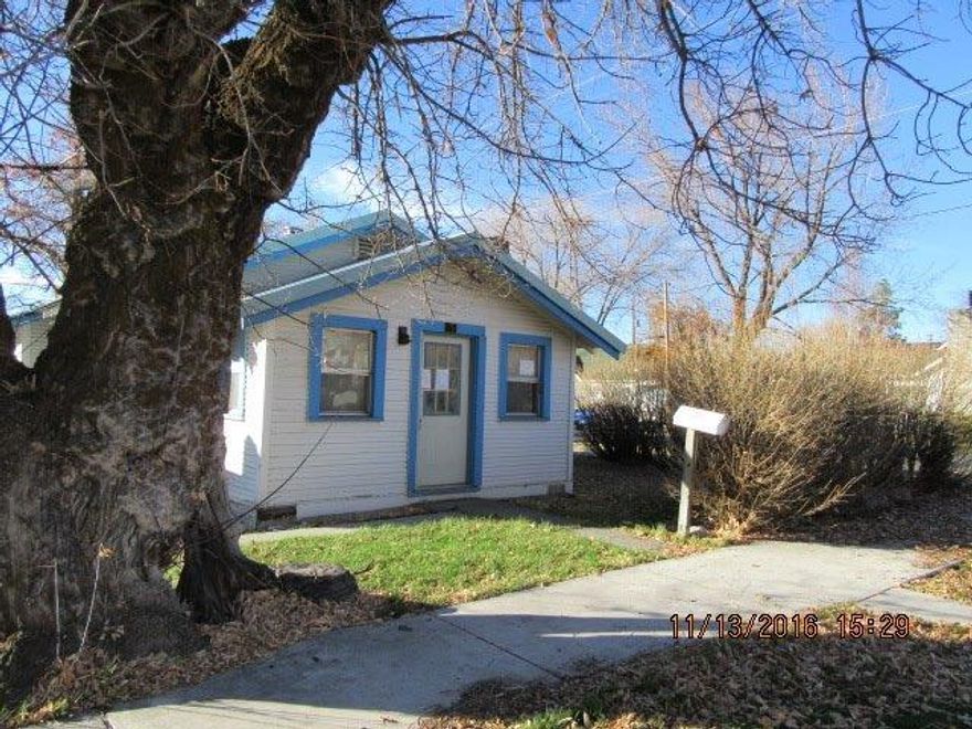 Over 1,000 sq ft of possibilities! Roll up your sleeves and get to work, there is so much potential with this 2 bedroom one bath home on a large corner lot and a detached garage with a spacious workshop area. It has a metal roof. The home needs updating. Bedrooms do not have closets.