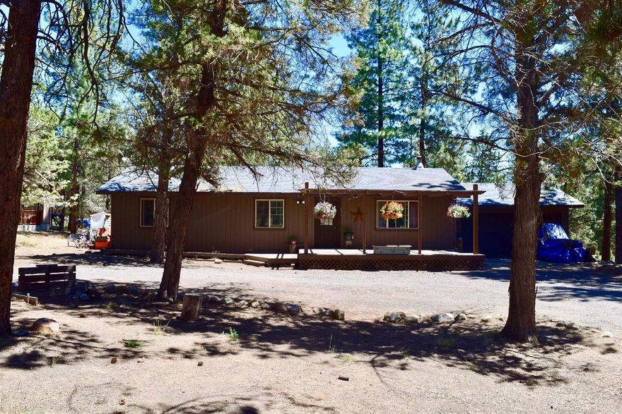 Rare find, just 6 miles from Sisters, OR and minutes from Whychus Canyon Preserve with hiking trails, Cascade Mountain Scenery and wild life. This home sits on nearly an acre, and features 3 beds/2 baths updated in the last 5 years. Gorgeous pine cabinets, copper counter top, glass tile backsplash, and newer appliances in kitchen. Engineered wood laminate flooring throughout, with a cozy wood fireplace. Fresh interior paint, covered front deck, expansive back deck and a circular drive way.