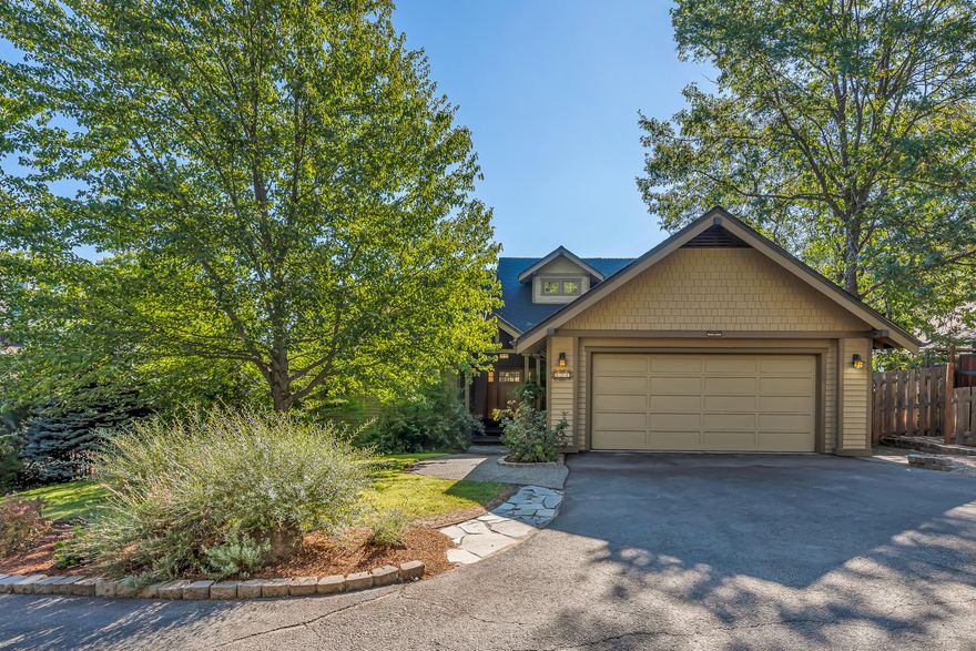 Spacious craftsman view home in a desirable neighborhood above the boulevard - just six minutes from the Ashland plaza and Lithia Park! Main level with solid oak floors, abundant natural light and air flow with operable wood-wrapped casement windows, vaulted living room with gas fireplace, formal and informal dining areas, family room, expansive view deck, kitchen with granite counters and dining island, stainless appliances including five-burner gas cooktop, office or second primary bedroom with full ensuite bath, laundry room, and two-car garage with EV charging stations. Vaulted upper primary suite with private view balcony, desk space with operable skylight, and full ensuite bath with soaking tub, shower, and double vanity. Lower level with two full baths and up to four additional bedrooms with interior and separate exterior entrances - including new studio apartment with kitchenette. Home is set back ~200' from Ashland Street in a private natural setting. Inquire for details!