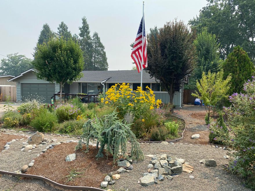 Just what you have been waiting for, this beautiful 4 bedroom, 2 bath home on .24ac with large private back yard, raised gardens, greenhouse and a chicken coop.  Home offers an open floor plan with lots of natural lighting.  Remodeled in the last 2 years with a new roof, gutters, fencing, flooring throughout, ceiling fans in each room, master & guest bath remodeled, walk-in closet, new dishwasher, stove & hot water heater. Freshly painted inside.  Large RV Parking and plenty of spaces for your cars.  Home comes with a 1 year Fidelity Home Warranty.  Close to schools and shopping.  This one is definitely a must see.