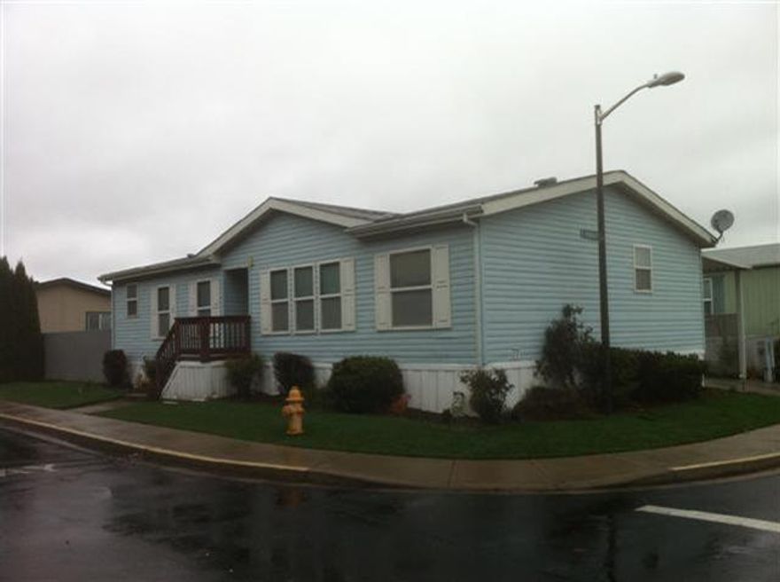 1999 Bulit Palm harbor, 3/2, 1350 sq. ft. Home offers additional turf landscaping, good sized back deck. Large storage shed and large carport.