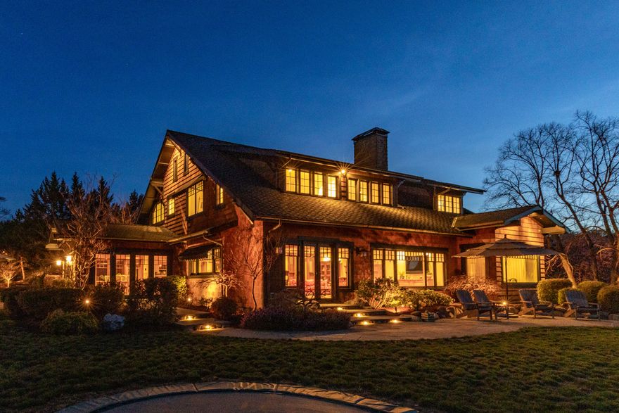 Minutes to town, Ashland, Jacksonville+Applegate. Come home to your private vineyard w/panoramic orchards+city lights views. Enjoy your spacious patio poolside w/sounds of waterfalls. Front walkway over a Japanese Joinery bridge to entry. Sellers rebuilt home from the studs, into this gorgeous Craftsman style home.  Use of high quality materials, reclaimed floors, custom woodwork and stone thru entire property. Chef's kitchen w/antique finishes, granite counters +a large leather granite isle/breakfast bar. Dining room has 3French doors, opens completely into an expansive slate patio. Original dual fireplace w/stone concrete mantle. A finished basement wine cellar has climate controls and for entire home. An entertainment center/wet bar designed by seller. 3primary suites. 3.5 Baths. Heated garage w/RV/a garden shed. Pool house area has full bath,+upstairs studio. AN established vineyard.  Large barn/banquet room.  Insulated stable +enclosed fence. More amenities listed