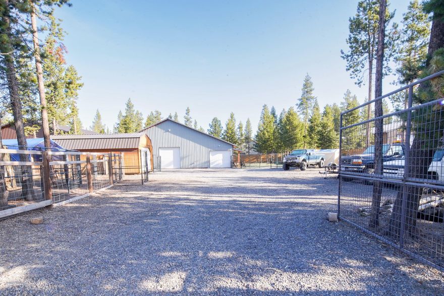 Room for all  your toys! Come by and check out this amazing lot with a 48' X 48' shop, fully fenced, private well, electricity and so much more. Features include: 400 amp service with 2- 200 amp panels. Private well with frost free spigots, RV pad with up to 80 amps pre-wired. Large lawn, all LED lighting. Roof is sheathed in plywood with vapor barrier, walls are double framed with exterior girts and bookshelf girts with blocking. Insulation: The ceiling is 5/6'' of closed cell spray foam with a fire retardant shell paint sprayed on, wall are R25. Lean-to has T-Foil system with R-38 insulation and the wall are R19. Fencing is Canadian Coastal Cedar. You will not want to miss out on this amazing property just minutes away from Sunriver.