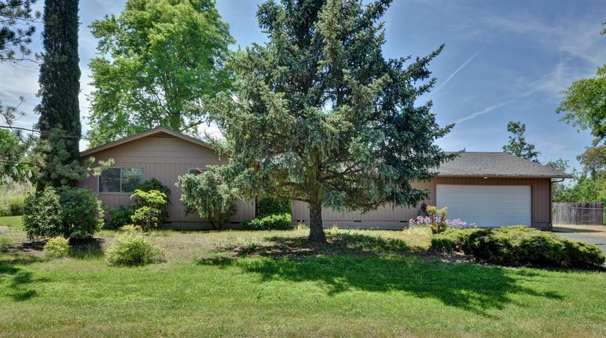 Located far back from the street to give some privacy. Two bedroom, Two baths. Formal Dining and Eating Area In Kitchen. Large Master Suite. Huge Lot with RV parking, Huge Backyard, Dog Kennel, Big Covered Patio, Oversized Garage with Shop In Back Of Garage. Lot is slightly less than 1/2 of an acre.