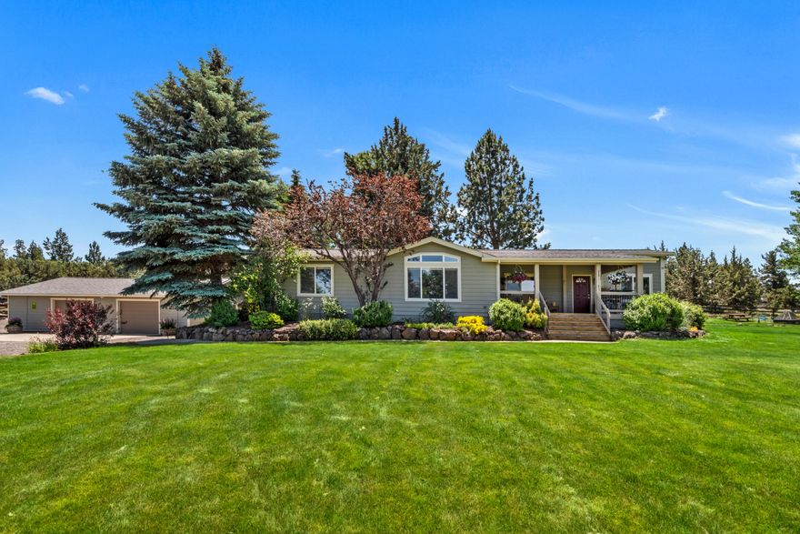 A meticulously maintained private oasis framed by sweeping mountain and pond views, this property is the definition of a park-like setting. The house is turn key, move in ready with many updates and quality finishes. Open floorplan with two large living areas both with vaulted ceilings and abundant natural light giving a sense of spaciousness. Comfortable living with a gas fireplace, luxury vinyl plank floors, tiled showers and baths, wood trimmed windows and solid doors. Step outside under the large covered decks and enjoy the cascading water feature. A 4-stall barn with power, water, tack room and large area for hay and tractor storage. A fully fenced 10 acre property with over 7 acres of irrigation, gated entry, cross fenced pastures, animal shelters, chicken coop, large garden area and a finished garage with built in dog kennels, what's not to love. Schedule your showing soon, you will not be disappointed!