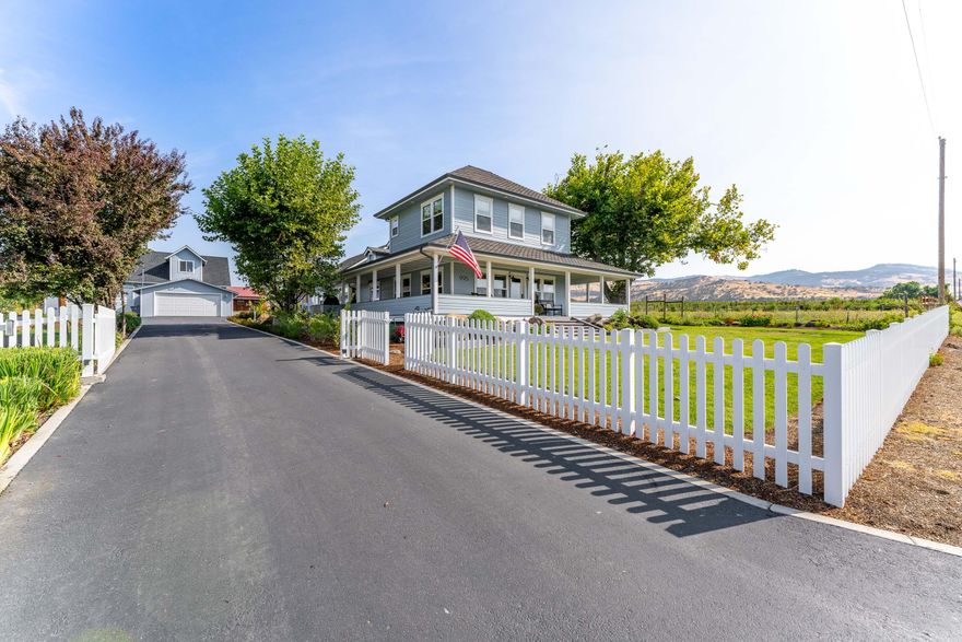This home is one of a kind! Built, originally in the 1900's but fully restored in 2019-2022. Nestled in the Talent area, this home is surrounded by orchards and vineyards. This 8.78 acre parcel has 5-6 irrigated acres, so your options are limitless. 2 spring fed ponds, 48x50 metal equipment shop, 30x30 wood barn/with 14ft lean-to. A large, 16x24 green house, raised bed garden, with adjoining small orchard, containing various fruit trees. A large detached 3 car garage with drive through option, and guest quarters above the garage, that has one bedroom/one bath, plus a spacious living area. The home is completely modernized, and is move-move in ready. This completely fenced in, irrigated property, is ready for your next adventure, should you decide to farm it, raise livestock, or plant a vineyard. Amazing views of the surrounding mountains, would also make for a beautiful wedding venue. Easy I-5 access, with Medford and Ashland only minutes away. This home is a ''must-see!'