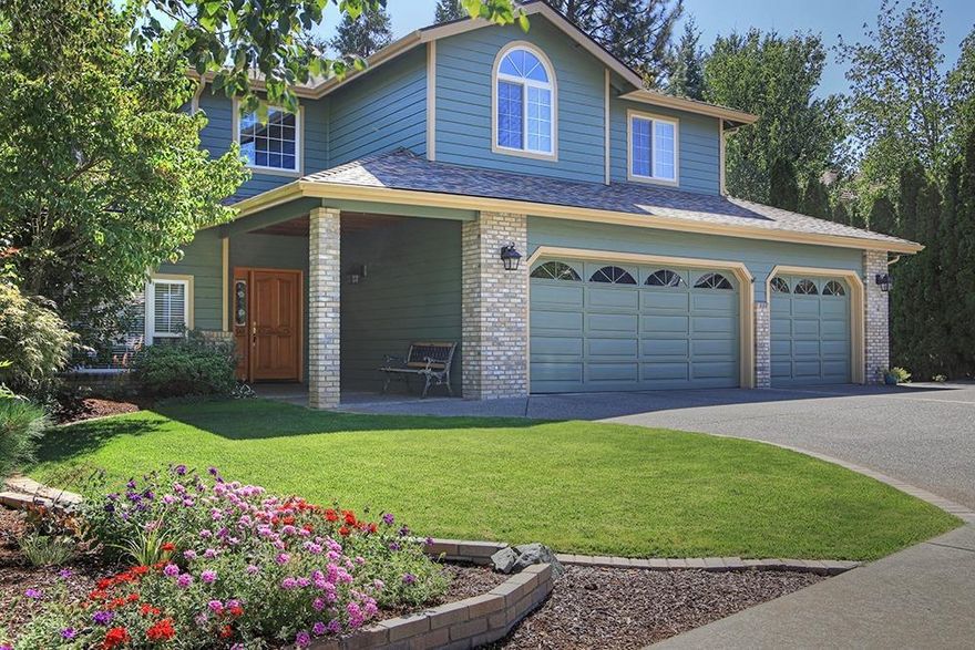 Beautifully designed and meticulously maintained, this custom owner-built home is available for the first time. The 4322 s/f floor plan boasts 5 bedrooms/4 baths that includes a separate living area downstairs with a backyard entrance. On the main level, a formal living area, formal dining room, an office, 3/4 bath and spacious family room with beautiful oak built-ins. The kitchen is a wonder, with lots of granite and tile, an island plus gleaming wood floors and a large casual eating area. This place was built for entertaining family and friends. Just steps away is the upper deck, protected by large shade trees...perfect for weekend BBQs. Up the curving stairs are three large bedrooms and an expansive master suite, with walk-in closet and roomy master bath. On the lowest level, step through sliding doors to a covered patio that leads to lush lawns, a raised garden area and a water feature that spills into a large pond. Triple car attached garage plus extra parking. Come take a look!