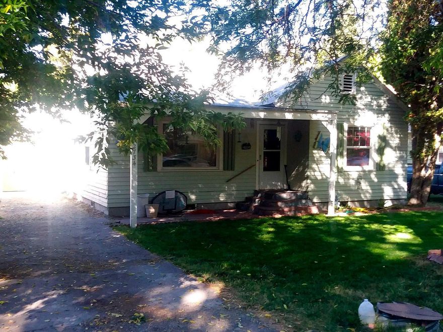 South Suburbs charmer, you are greeted with hard wood floors in living and dining rooms Attractive arched entry into dining room with coved ceilings & built in china cabinet. Kitchen and laundry room newly remodeled except for appliances. Behind the garage but not visible from street are two extended rooms approximately 14' x 28' for a workshop, storage or use as you choose. Fenced backyard with matured landscaping. Back alley access. Wiard Water Park within walking distance. Located between South 6th Street and Southside ByPass.