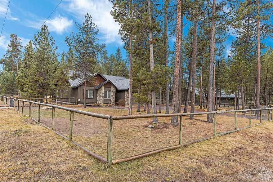 Don't miss this beautifully upgraded single-level home on nearly a 1/2 acre corner lot in the peaceful pines of Oregon Water Wonderland. Just a block from Crosswater Golf Course (no access) and close to the Deschutes River community boat launch. Home features stainless appliances, hardwood floors, heat pump, new wood stove, covered back patio w/ lighting, granite countertops, stone accents & more! Property is fully fenced and features RV parking, a custom shed/studio & wood burning firepit!
