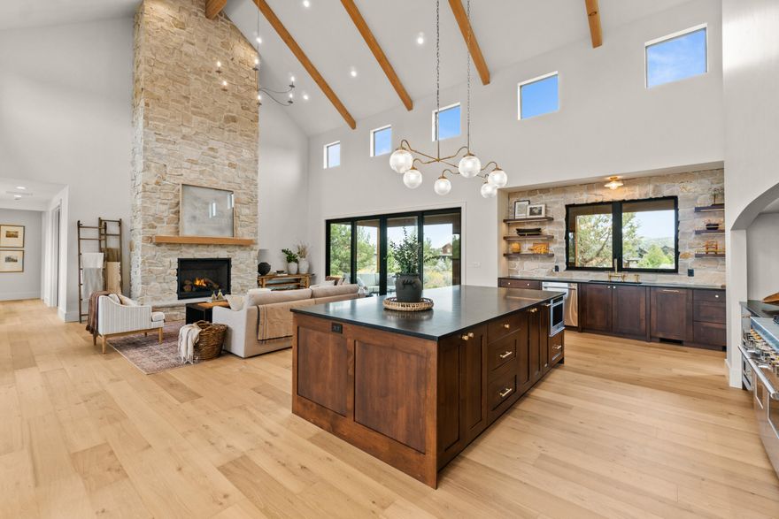 Set amidst wide open vistas and designed to capture the incredible views and abundant natural light, this stunning custom home is at once elegant and welcoming. A towering cathedral ceiling graces the open concept main living area with floor to ceiling fireplace and a to-die-for kitchen. Endless granite counters, a 48'' gas range, oversized center island & an extensive pantry offer everything a chef could want while the adjacent covered patio is perfect for open air dining. A well designed floor plan with separate wings includes one with dedicated office & luxurious primary suite with vaulted ceilings, private patio & bath with heated marble tile floors, curbless shower & soaking tub. The 2nd wing features two ensuite bedrooms & mudroom with plentiful cabinetry. A top ranked resort, Brasada Ranch provides exceptional amenities including renowned golf, a full service fitness center, restaurants, spa, heated indoor & outdoor pools, tennis & pickleball courts & endless outdoor activities.