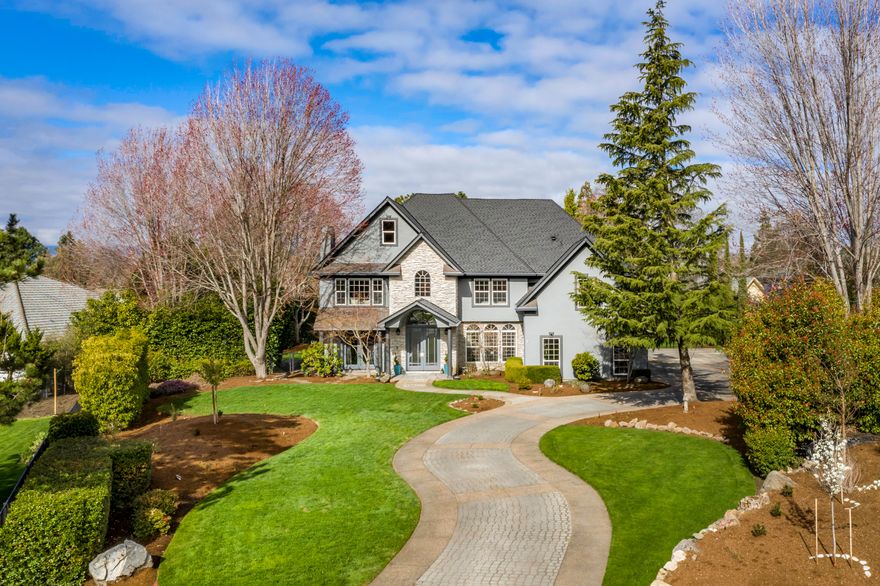 Stunning E Medford home! Recently remodeled & luxuriously appointed near RVCC in a desirable location at end of a cul-de-sac. This gorgeous home boasts 4 bedrooms (one currently used as bonus rm), 4 full baths w/separate pool bath, formal & informal dining, intimate sitting room w/ gas FP, stunning foyer w/ dramatic circular staircase & private office w/ beautiful views. Huge master suite w/ tray ceiling, lovely sitting area & spa like ensuite w/ large shower, freestanding tub, heated floors, dual sinks & oversized dressing area. The spacious & elegant kitchen equipped w/ chiseled edge granite countertops, high-end appliances, massive pantry, separate beverage rm w/ ice maker, wine & beverage refrigerators. Enjoy the open & spacious great rm, w/ strikingly tall ceilings & tons of natural light while overlooks the private backyard, patio, inviting pool, spa & pool house-studio. Truly an entertainer's dream!  All of this & more on .57 acre lot w/ park like setting & tons of privacy.