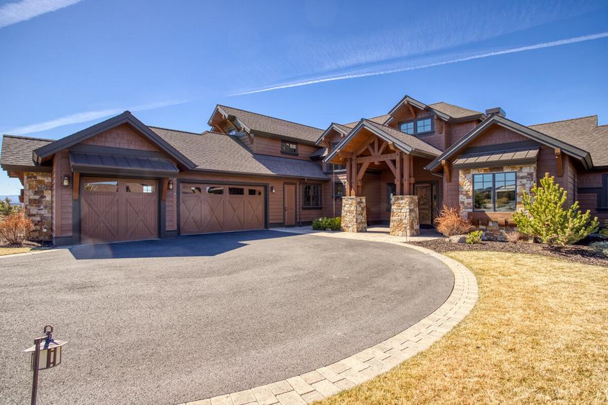 Northwest style home with views of the inspiring Cascade Mountains. This home is designed for entertaining with an expansive great room concept, four bedrooms, five bathrooms, a bonus room and wine room. Exquisite home features an open concept great room with a wood burning fireplace flanked by custom built-ins and rising to meet the wood beamed ceiling and a stunning view of the Cascade Mountains. The kitchen features knotty alder cabinets, a coffered ceiling above with a farmhouse copper hammered sink. It also has an expansive island for gathering and entertaining. Appliances include a double oven, dishwasher, refrigerator, microwave drawer and warming drawer. The master suite is complimented by a lovely master bathroom, which includes a tub, shower and separate vanity and sinks that are as beautiful as they are unique. The outdoor living area offers an exquisite sitting area and outdoor kitchen to take in the ambiance and views of the pond and sweeping Cascade Mountains.