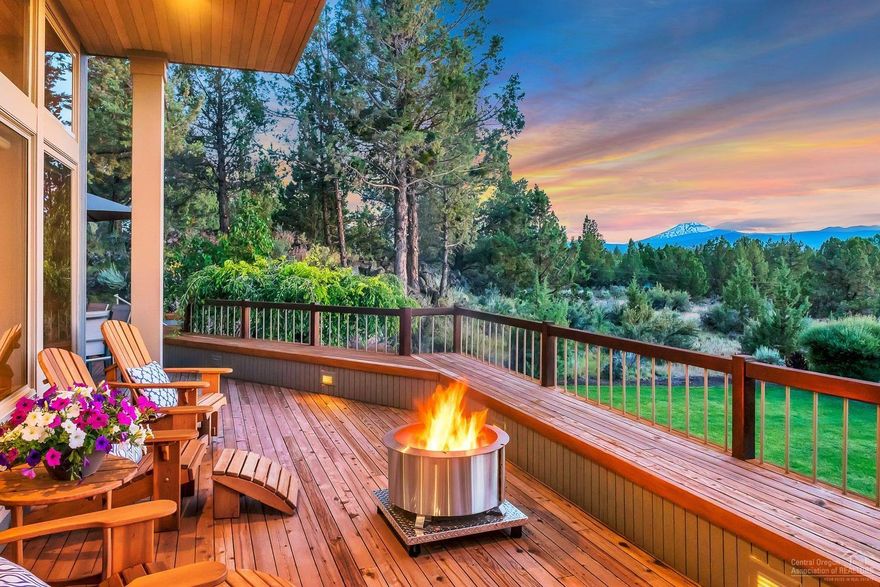 A rare opportunity to own a remarkable estate in a serene setting, just minutes to Bend and Tumalo! This Northwest Regional home is perfectly perched on five private acres, with breathtaking Cascade Mountain views from nearly every window. The 3455 square foot 4 bedroom, 3.5 bath home is neatly arranged with dual master suites, formal living room, large family room, both formal and informal dining areas and a sunroom. The gorgeous kitchen has dual ovens, island, pantry, wet-bar and counter seating and opens to nearly 2500 s/f of decking ideal for entertaining. Park-like lawns with lava-rock outcroppings surround the home, and there is even a small golf course! The paved private driveway leads you to the attached oversized 3-car garage, a brand new 36x48' RV/toy barn, and additional covered parking. A private peaceful oasiswith all the benefits of city living!