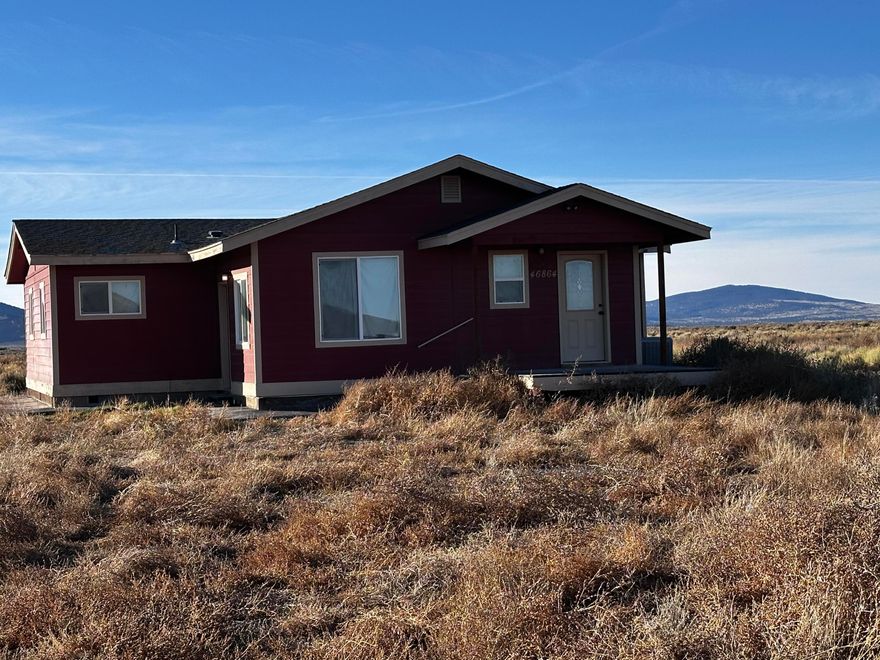 Awesome Mountain views! Sit on your patio and watch the sunsets over the mountains like Sleeping maiden and Tablerock Mountain to name a few. 60 acres provides plenty of room to roam in this beautiful updated 1080 Sq ft Manufactured home with additional 288 sq ft addition for 2 Bonus rooms, One could be used for an office and the other a 4th bedroom. Located just a short drive from Silver Lake or Christmas Valley. Open great room plan, updated kitchen, Wet Bar, vinyl plank flooring and carpeting. Also has a heat pump for Central Air Conditioning and heat. Features concrete walkways, spacious front deck and rear concrete patio, in ground sprinklers. This home has been moved once to this location verify financing options with your lender of choice. It is set on a permanent foundation of block, post & pier. Well was formerly a commercial well and is approximately 400' deep. May be possible to divide parcels into 3 20's but buyer should confirm any ability to partition with the county.