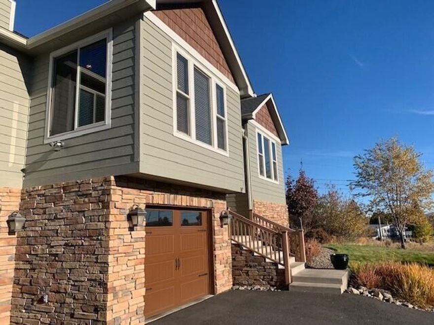Beautiful well kept home built in 2008 by Turnage. Has Hardi plank type concrete siding. Lovely glass pane front door. Keyless entry. Two levels with bonus room. Beautiful finishes, custom tile, wood floors throughout. Borror cabinets. Great kitchen with granite counter and tile back splash, full dining room and nook, Great room. Very nice master suite. His and her walk-closets.  The downstairs has the bonus room, lots of storage and finished 2 1/2 car garage. Work room at end of 1 garage. Big storage room near laundry and Bonus room. Landscaped yard and back patio. Home features a view of Klamath Lake, shop/storage area. The family room is prewired for a home theater system and whole house 7.1 audio system. Front and back yard is fully landscaped with sprinkler system and drip line. Extra RV or boat parking on the side. A very light & bright home!