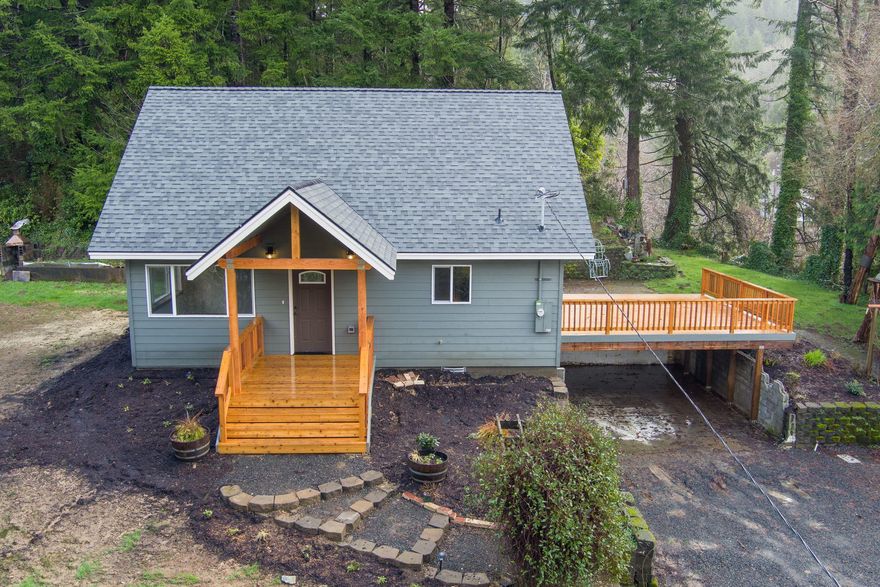 Enjoy your privacy near the beach on this serene two+ acre parcel. Brand NEW 2 bedroom, one bath home w/an open floorplan w/cathedral vaults. Custom kitchen w/Quartz counters. Cozy bedrooms & central bath. Setup for stackable W/D. Home sits back off road w/ huge garden area & forest. Close to schools & just minutes to Newport. Huge deck is perfect for entertaining. Outdoor firepit, water feature & space for garden. 32x40 3 bay shop w/covered parking. Bring your RV & toys!