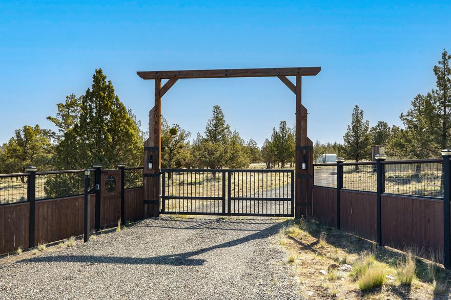 Discover the ideal homesite with Cascade Mountain and Smith Rock views! This 5-acre parcel in Mountain View Estates offers a flat, rectangular plot amidst upscale homes, paved streets, and buried utilities—no HOA fees. Installed Avion water with frost free spigot, CEC electric (400-amp service), and approved capping fill septic system make it ready for your custom build. Enjoy the hand crafted entrance gate, solar-powered with keyless pad. 6-foot deer fencing enclosing the entire perimeter for added privacy and security.  A 10x25 metal shed with concrete foundation is on-site. Located on a quiet cul-de-sac, Joshua Court ensures tranquility. Bring your Builder and explore this spectacular property to capture the views.