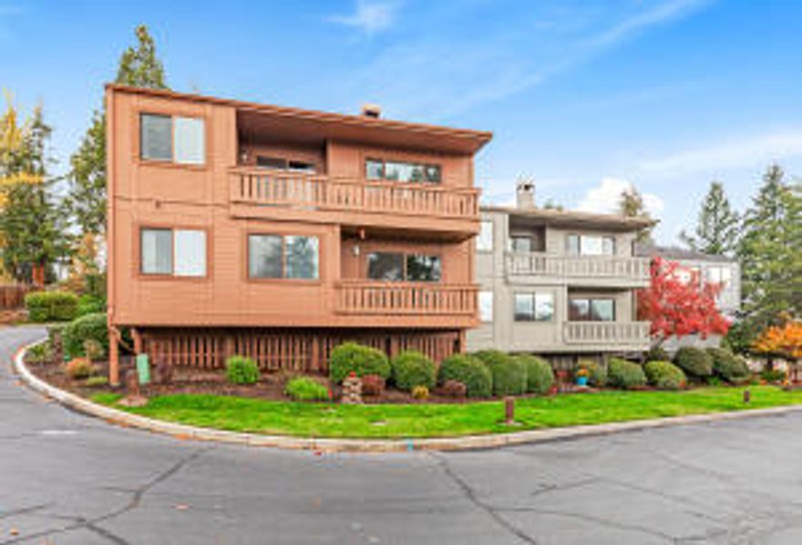 Welcome to your immaculate hilltop condo with breathtaking views! This home is open and bright with a soaring entry flooded with natural light. Enjoy the stunning views from 2 decks. Updated w/ hand scraped wood flooring, HVAC replaced 4 yrs ago and new roof, family room with cozy fireplace and built ins adding character & charm. A full sized dining area for your family gatherings off the kitchen plus a slider to the deck. A spacious galley kitchen w/ additional dining and deck access to enjoy your morning coffee while taking in the views of the Rogue Valley and Mt Ashland. The lower level boasts a huge master suite and additional bedroom. Plenty of storage with and built in cabinets. A roomy two car garage with pulldown storage. This pristinely maintained community offers a gorgeous swimming pool, tennis courts, and mature landscape. This is carefree living just minutes from medical, shopping, dining and more.