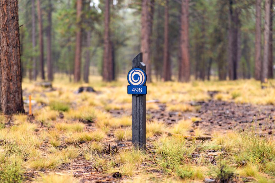 Discover the unmatched lifestyle of Caldera Springs with limited-time special pricing and exclusive incentives on select homesites in our newest phase. Incentives are available for homesite purchase contracts written by December 31, 2025. Take advantage of 5% off list price and Developer paid HOA dues through December 31, 2026. Homesite 498 is a  premier lot offering a stunning blend of natural beauty, pine-filled landscapes, and endless blue skies.  The central location of this lovely .33 acre homesite provides ideal access to both the Lake House and Forest House.  Backing to common area and near the stunning Lava Springs Lake, this lot provides a serene setting for building your custom home. Owners enjoy special access to the Forest House Amenity & Aquatic Center along with golf, fitness, pickle ball, tennis, pools, kayaks & paddle boards. Caldera Springs is located near Sunriver, just 15 minutes to Bend and 30 minutes to world class skiing at Mt. Bachelor. Taxes TBD.