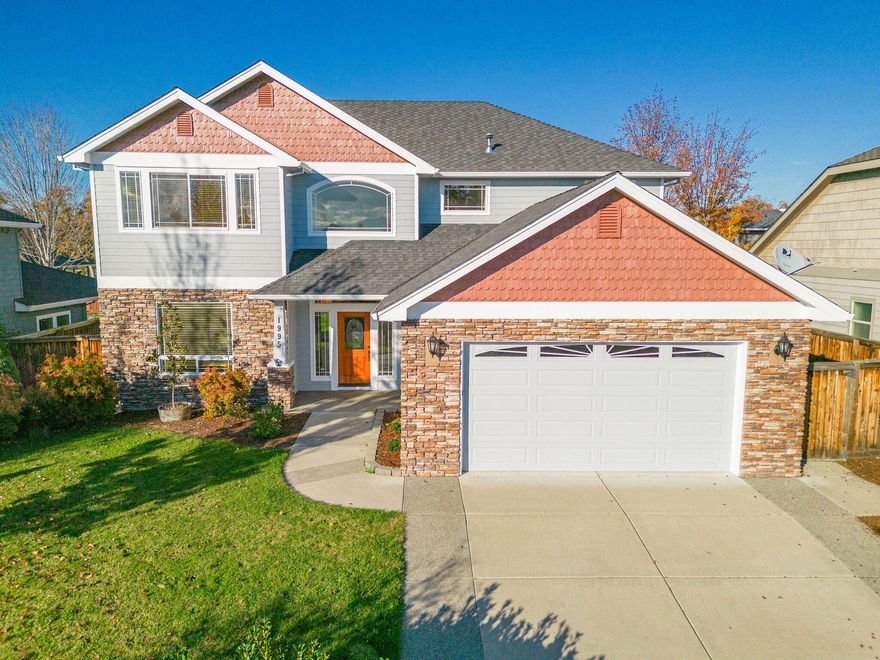 Appraised 7-2023 at $628,000!! Instant Equity! Enjoy peaceful living in the highly coveted Blue Grass Downs neighborhood. The home has many upgraded architectural details! This 5-bed, 2.5-bath, 2,790 sqft beauty is a must-see, meticulously crafted with custom features. Separate living, dining and family rooms. The kitchen is a chef's dream, boasting granite countertops, custom cabinets and a center island with vegetable sink. Revel in the warmth of real oak hardwood floors and custom woodwork throughout, complemented by coffered dining room and master ceilings. The gas fireplace with mantle adds a touch of elegance to high ceilings. The spacious master suite has a jetted tub, large walk-in shower, and dual sinks. The flexible downstairs room serves as a 5th bedroom or office. Fully landscaped front and back yards with timed sprinklers, mature landscaping. Oversized finished 2-car garage. Located in the Rogue Valley, this residence offers a country feel with town convenience.