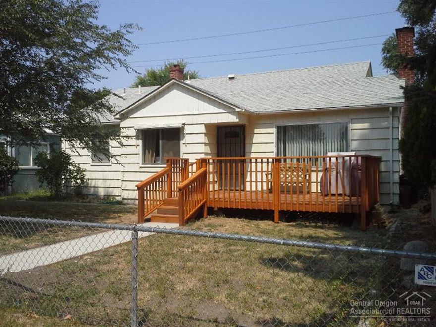 Vintage 3 bedroom, 2 bath home with cyclone fenced yard in town. Double car garage and double carport with access on 6th Street. New natural gas furnace in 2014. Newer kitchen tile. Older original hardwood flooring. Master bedroom has bath. Patio in back, deck in front. New interior paint. New just installed carpet in bedrooms.