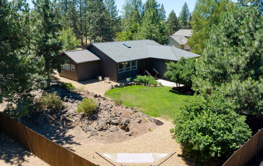 Prime SW location with an ambience that radiates cool vibes. This property has the ''it'' factor. New windows, vaults and hardwood flooring lend an airy feel to the space, offset by earthy hues to create an environment that both looks and feels good. The gorgeous wood floors extend into the newly overhauled media room finished with swanky built-ins and mood lighting. Outside, discover multiple newly installed patios with space to both entertain and container garden. A natural rock outcropping established on the east side of the lot adds privacy and character to the outdoor space. No neighbors in back, just common area!