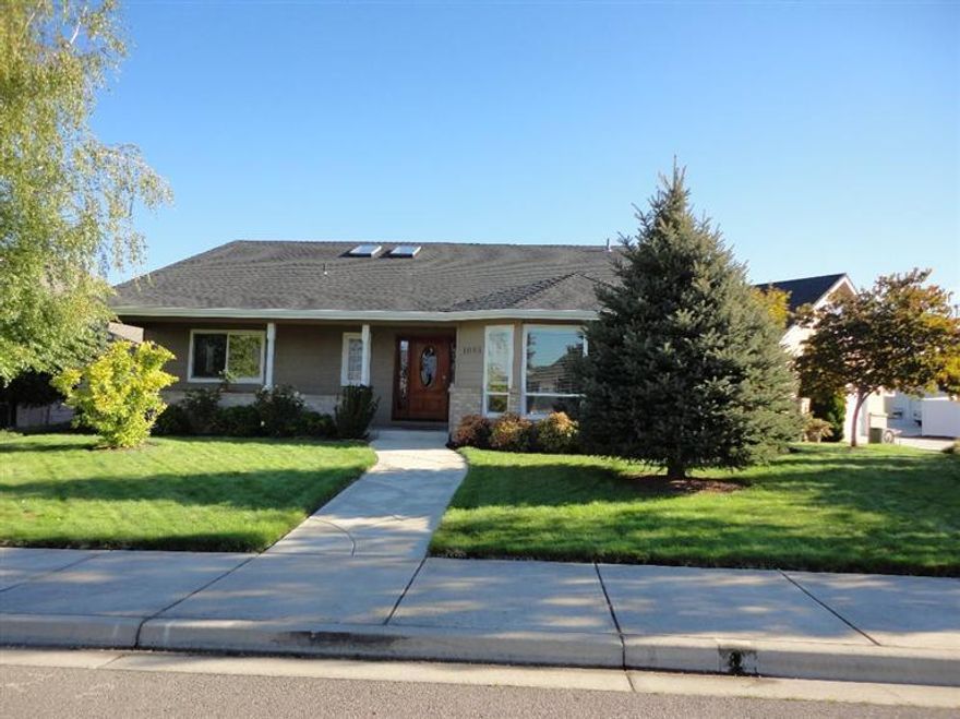 This 3168 sq. house in the Golf Course Community has. a large in-ground pool with gas heater. The kitchen has granite countertops a walk-in pantry, 5 burner gas stove and electric oven, and hard wood floors. 4 bedrooms and 2 full & 1/2 baths, with marble countertops, on the first floor. The master bedroom has a walk-in closet, and a fireplace. The master bath has a jetted tub and a large shower. The home also has a central vacuum and 3 skylights and ceramic tile in the baths and garage entry. Along with the living room with fireplace and dining there is a large loft used as a den or family room. A bonus room or extra bedroom is upstairs near the half bath. The large lot has three patios. One cover patio from the house that has stereo speaker system, the second is a secluded fire pit and berry garden, and the third is a courtyard with brick wall, and arbor gate. The finished garage is fully insulated with a utility sink. The garage can be accessed from the side alley.