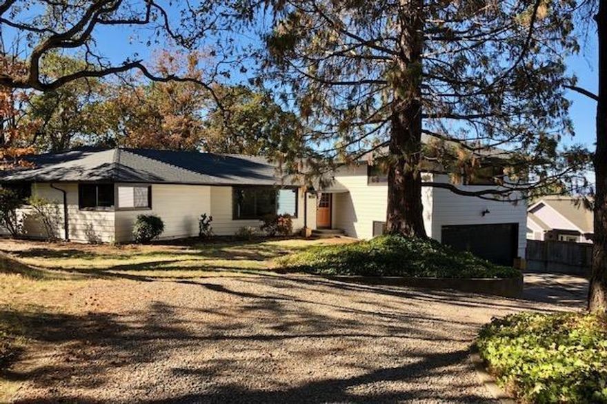 Urban Contemporary Farmhouse on huge .74 acre lot with city utilities! Beautiful vaulted living room with solid hardwood floor, wall of windows and designer chandeliers. Open and bright gourmet kitchen with Carrera marble counters, subway tile backsplash, island seating for 5 and custom range hood, stainless farm sink, stainless gas range, recessed lighting. Half bath and laundry off kitchen. Large dining with french doors and views of valley and table rock! Master ensuite on the main floor with french doors and marble tile shower and floors, double sinks with quartz counter and walk-in closet. Large main hall bath with double sinks, open shelving tub/shower combo, marble counters and tile floors. Two main floor bedrooms both with double closet doors. Large family room above garage with brand new carpet and two closets could be 4th bedroom. 2 car garage with circular driveway on quiet dead end street. Lot can be subdivided buyer to check with city.