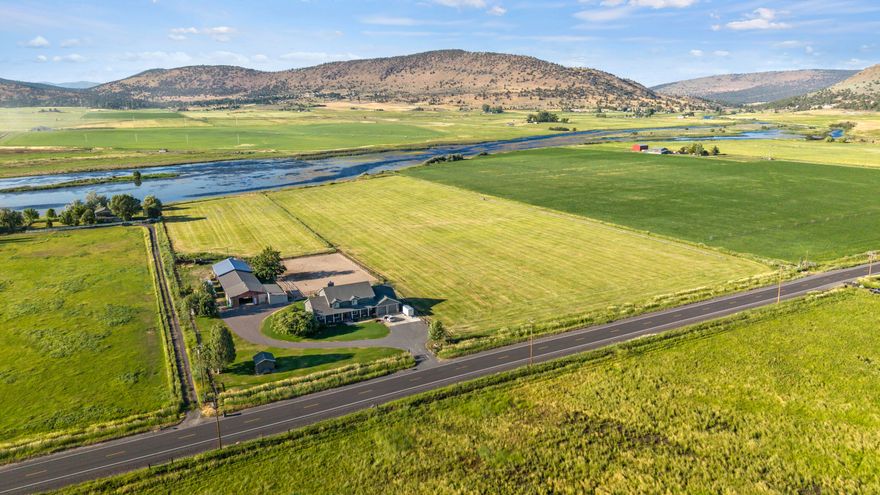 PRICE REDUCTION! Experience the epitome of riverfront living on this exceptional property. Featuring over 15 lush acres of pristine land right on the river, pasture ground, an arena, barn with stalls and tack rooms. The home is magnificent from top to bottom; birch hardwood floors, hickory cabinets, fresh LED lighting throughout, there is even a bonus room, loft and office in addition to the 4 bedrooms. Create your own private oasis on this ranch  with potential for horse enthusiasts, farming, bird hunting, lease out the farm ground, running some cattle or even 4-H & FFA projects. This property is fully set up! Enjoy the A water irrigation with all irrigation equipment is included. There is also a  30x34' shop with additional storage rooms added on. This property is unique in every way, take advantage of this rare opportunity to own a slice of heaven.