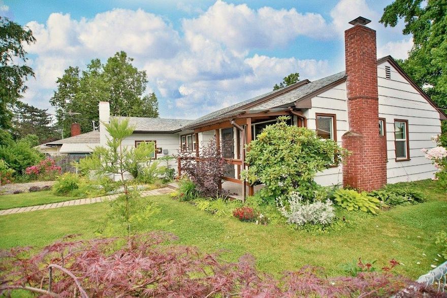 Move In Ready. Well maintained Cottage sitting inside a Fenced Yard with Garden Plants Galore and a Green House. Comfortable 2 bedroom, 1 bath, 1283 SqFt home with a quality kitchen, stainless appliances, on-demand H2O heater, hardwood floors and a wood fireplace. This home is clean as a whistle.