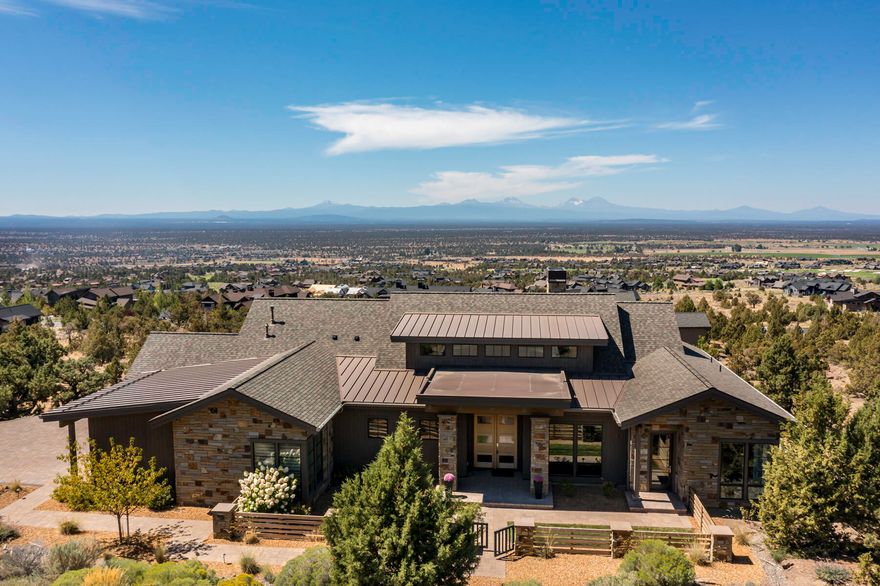 One level living featuring expansive views of the Cascade Mountains. This beautifully designed custom home offers two primary suites separated by a vaulted great room. The 445 square foot attached Casita with private entrance includes kitchenette & walk in closet lives like a luxury hotel room. 3 bedrooms 3.5 baths, 3rd room in main house has Murphy Bed which can be used as a guest room, office or exercise space. Gated pet/mudroom area off 3 car garage entry.  The 12' La Cantina pocket door system creates a seamless indoor/outdoor entertaining experience. The expansive western facing covered deck with automatic sunshades provides a protected space to enjoy a BBQ, stunning sunsets & the mountain views. This home offers a quiet respite in the natural beauty of Central Oregon & Brasada Ranch. Enjoy all the luxury amenities, including golf, athletic center with pools, gym, exercise studio, tennis/pickleball courts, restaurants, spa, general store & miles of bike & walking trails.