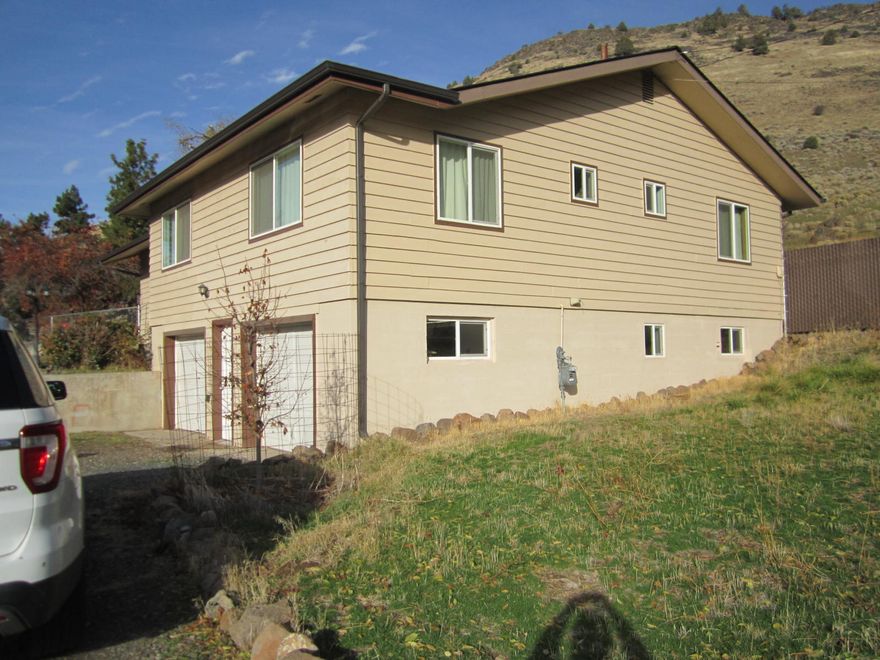 Peaceful country setting on 5 acres, yet close to town. Relax as you view Klamath Lake & Cascade Mountain Range. The lane on this full fenced property leads you to the 3 bedroom, 2 bath home. Primary suit offers walk-in closet, good size on the 2 remaining. Living room sports incredible views of the valley below. Entertain the weekend guests, family with the cabin with loft, the guest house with loft. Then admire the well designed chicken coop. Detached 2nd double shop garage with cement floor is divided in 2 rooms. The Kitchen over looks the back property with updated appliances and snack bar. The well natural lighted bonus room off kitchen leads you to the back yard.	Interesting property, with it's 
acreage and outbuilding. Call now to view.