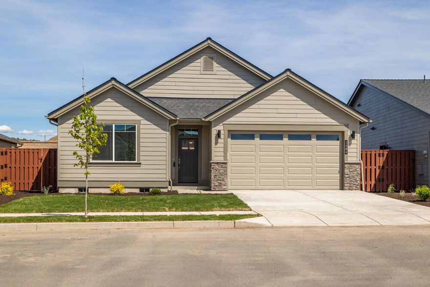 $15,000** preferred lender incentive for closing costs &/or buydown! Award-winning builder, Pahlisch Homes, known for quality construction, style, & state-of-the art finishes. Covered rear patio facing east that is perfectly poised to enjoy colorful sunrises & cooler, shaded summer afternoons. Feng Shui west-facing front door said to enhance energy flow and harmony. This beautiful new single-level home features engineered wood core plank flooring from entry through main living area, baths, and utility room. Greatroom has cozy gas fireplace open to the kitchen w/eating island & full-height tile backsplash. Tiled primary suite shower and A/C included! The HOA takes care of the front yard maintenance. Amazing neighborhood amenities include swimming pool, parks, play area, 1/2 sports court, community walking path along protected wetland reserve also accessing acres of public trails up Barnes Butte. Specs/finishes vary. Visit open house Fri-Mon 12-5 pm for a tour.  Ref #OP214 - Carrera A.