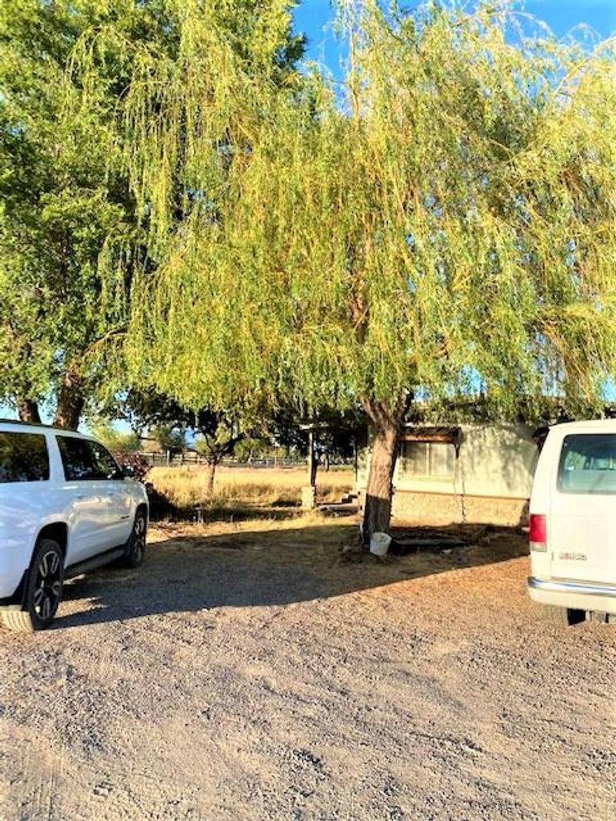 Here is your chance to get 3.52 acres with irrigation!
Corner lot, some views! 
3 bedroom, 2 bath manufactured home. Live here while you build a dream home!!! Or simply relax and enjoy some space! Excellent location for commuting! Close to town, yet in the country.
Cash buyers only.