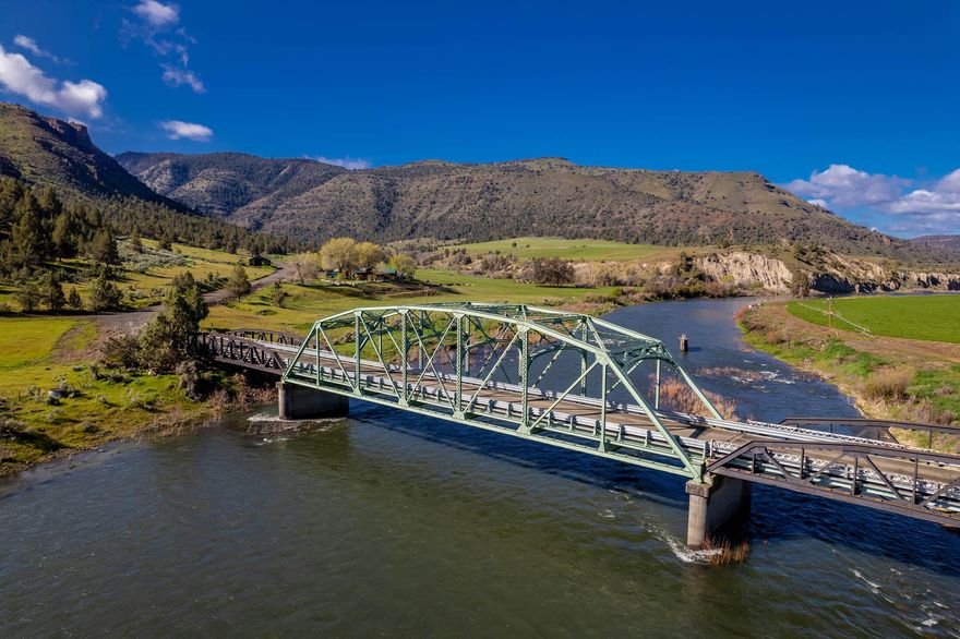 Campbell Crossing Ranch, owned by the Campbell family for 72± years, boasts 1.9± miles of North Fork John Day River frontage. Rudio Creek flows through the ranch for 1.45± miles. Additionally, the ranch borders thousands of acres of BLM land and has 296±. Acres of water rights. Appreciate the topography of the ranch as it rises in elevation from 1,880± ft. at the lush fields along the river to 4,860± ft. Fish for smallmouth bass and native steelhead trout in the North Fork of the John Day River! Hunt for mule deer, Rocky Mountain elk, pronghorn antelope, upland game birds, and waterfowl, or just enjoy watching the plentiful area wildlife, including bighorn sheep. The ranch's two homes include an updated farmhouse with 4 bedrooms, 2 baths, spacious mud/laundry room, chef's kitchen, large living room, covered deck, two patio areas, hot tub, pool with a deck, plus a 2-car detached garage; and a 2 bedroom,1.5 bath, with an open floor plan and grand views of the John Day Basin terrain.