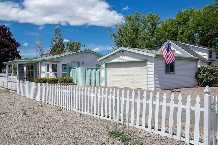 White picket fence curb-appeal w/ low maintenance landscape, this super clean & well maintained 3/2 home on .17/acre lot is a great opportunity for under $300! RV, Boat, or extra vehicle parking area in front. Asphalt driveway, concrete pathways, detached 2 car garage w/ work bench & shelving. Home has a nice covered concrete patio, plum tree, curly willow & great large, fenced back yard. Forced heating & air recently serviced, vaulted ceilings throughout, 3 bedrooms w/ split bedroom plan for privacy and each w/ its own walk-in closet! 2 full bathrooms! Kitchen offers great lighting w/ breakfast nook in rounded garden window & skylights, Fridge, range/oven, microwave & a new pull-out faucet in sink, open pass thru to living room. Solid concrete block perimeter foundation w/ a large crawlspace w/ vapor barrier. Pest contract in place for one year. Roof is newer (last 10 years). Furnishings are negotiable or happily included. Home Warranty!