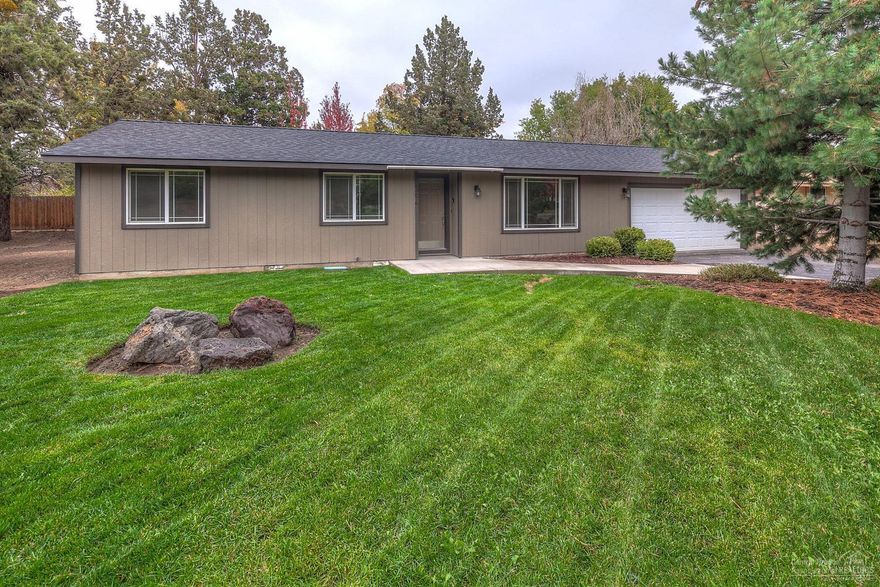 NE Bend home on .34 acres, completely re-finished including roof,paint, grg door, flooring & more! Hickory & Maple cabinets. New appliances & fixtures throughout. Extra large bar area w/tons of storage & ctr space. New hardwood, custom tile, premium carpets. Beautiful granite counter tops in the kitchen & Master bath. Tiled floors & tub surround in guest bath. Tons of space for shop, toys, rv's or home addition. Property backs to the canal greenbelt that runs for miles.