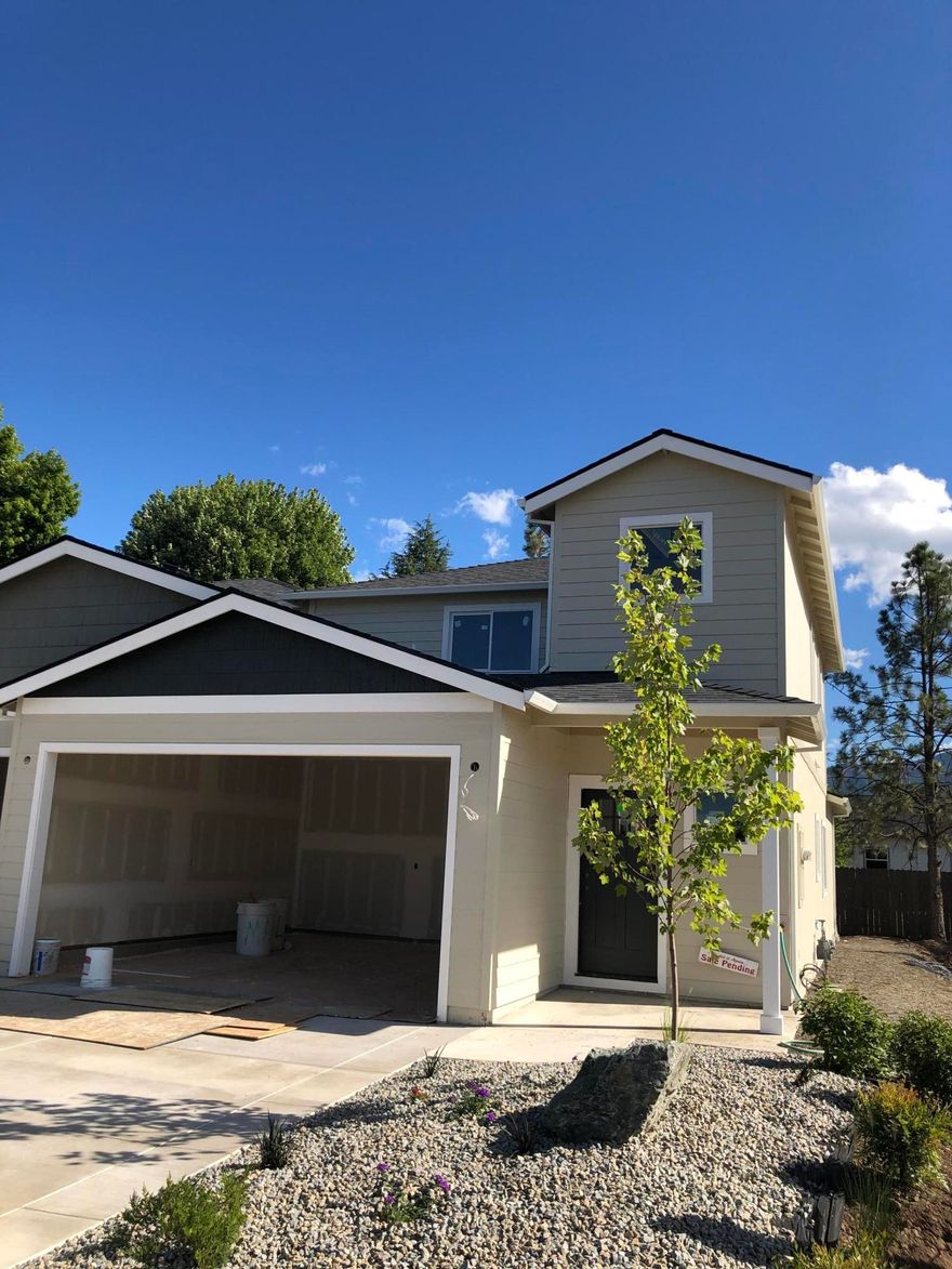 Another Beautiful, Brand New, Completely Custom-Built Home Built w/Impeccable Attention to Detail by Lori Magel Homes. Excellent location – just across from South Medford High School, in the brand new community of Jordan Village. This custom built home is light & bright w/open floor plan & lots of windows. So many upgrades & extras we wish we could list them all. Gourmet kitchen w/high-end custom cabinets, granite countertops, upgraded stainless steel appliances. Main level has open great room, large kitchen with island, and ½ bathroom. Upper level has 3 nice sized bedrooms and 2 full baths & laundry room. The master is large with walk-in closet & 2 sinks. High-end laminate flooring in the entry, half bath, living room, dining area, kitchen; tile floors in laundry room and bathrooms. Enjoy the convenience of the on-demand hot water heater. Beautifully landscaped front & back yards w/timed sprinklers & fully fenced back yard included. All this + 2 car finished garage.